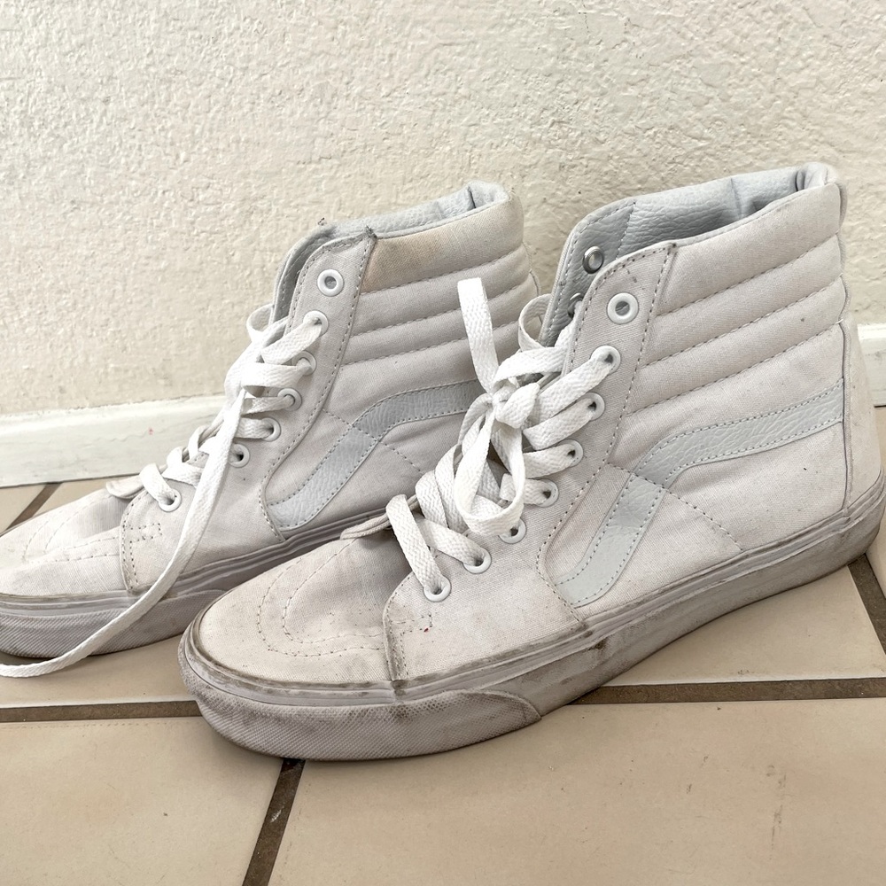 All white high-top Vans, size 9. Slightly worn, just needs to be cleaned up.
